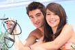 Young couple sailing a catamaran