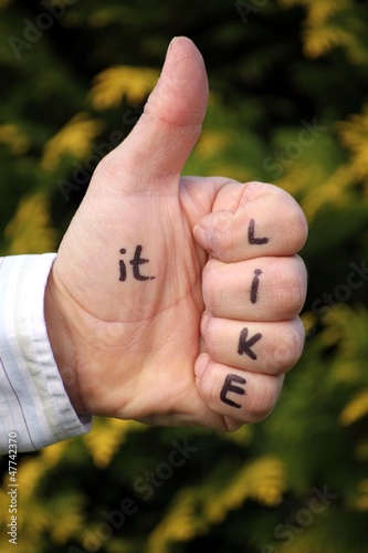 Photo: "like it" auf Hand geschrieben Daumen ist hoch "like it" auf Hand geschrieben Daumen ist hoch