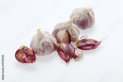 Photo: fresh garlic on white background fresh garlic on white background