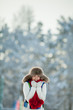 Foto: Young woman in a snowy furry hood Young woman in a snowy furry hood