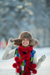 Foto: Young woman in a snowy furry hood Young woman in a snowy furry hood