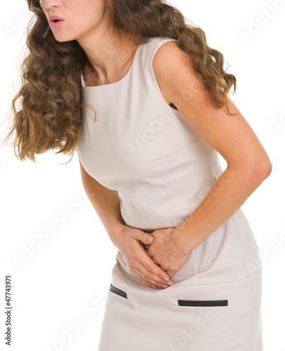 Photo: Closeup on woman having stomach pain Closeup on woman having stomach pain