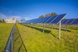 Solar panels in field with blue sky