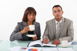 business people examining a project with a coffee
