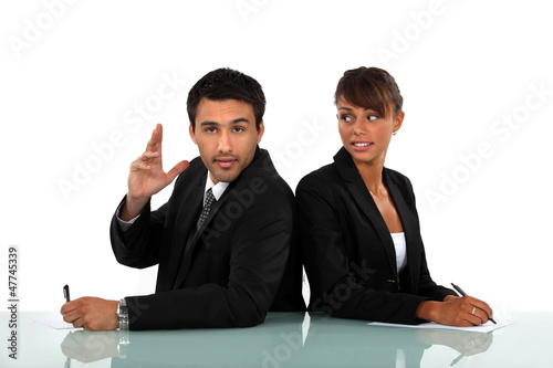Photo: business colleagues standing back to back business colleagues standing back to back