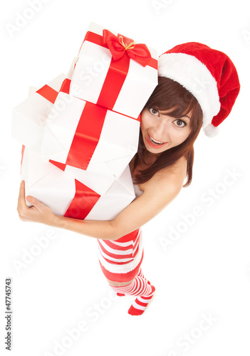 Photo: Happy santa woman with gift boxes Happy santa woman with gift boxes