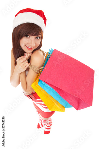 Photo: Fun santa woman with packages Fun santa woman with packages