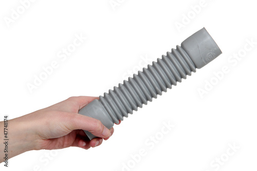Photo: Hand holding corrugated pipe Hand holding corrugated pipe