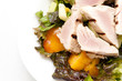 medium rare tuna fillets slice over a fresh salad