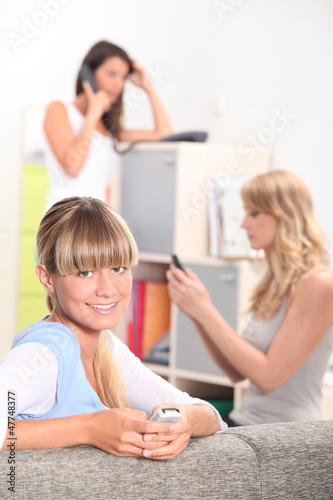 Photo: Young woman sitting at home Young woman sitting at home