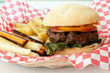 hamburger and french fries with carrot sticks