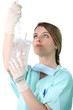 Photo: Female nurse administering a drip Female nurse administering a drip