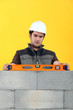 Bricklayer with a spirit level