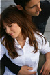 Attractive couple sitting together on a deck