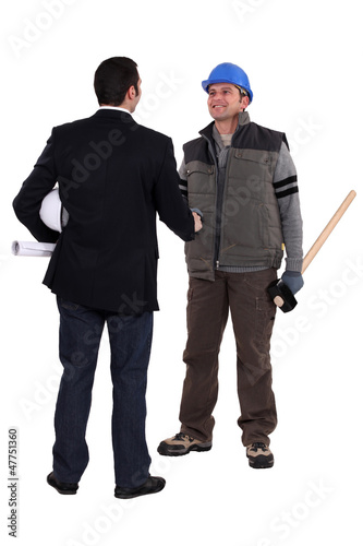 Photo: craftsman and businessman shaking hands craftsman and businessman shaking hands
