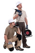 Tradesmen holding their tools