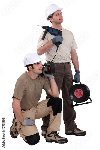 Photo: Tradesmen holding their tools Tradesmen holding their tools