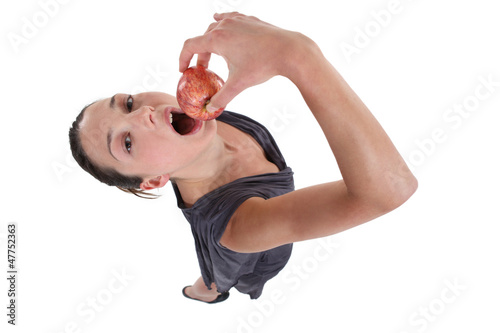 Photo: Woman eating an apple Woman eating an apple