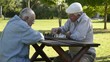 Active retirement and free time, four elderly men playing chess