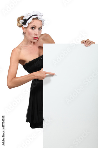 Photo: Blond woman dressed in maid costume Blond woman dressed in maid costume