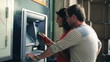 Video: Young couple withdrawing money from an ATM, steadycam shot Young couple withdrawing money from an ATM, steadycam shot
