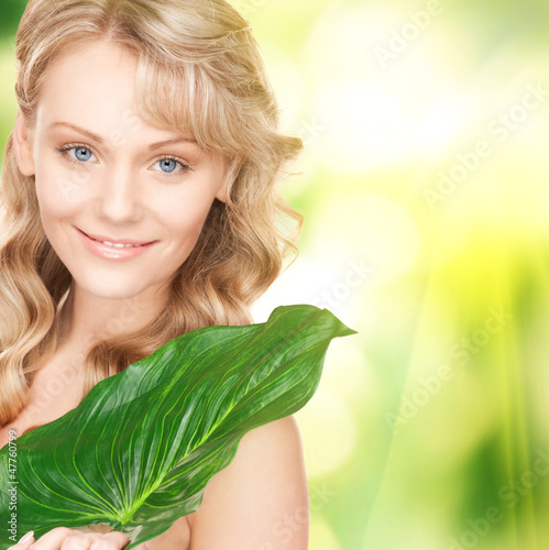 Photo: woman with green leaf woman with green leaf
