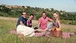 Video: Group of happy friends playing cards on picnic Group of happy friends playing cards on picnic