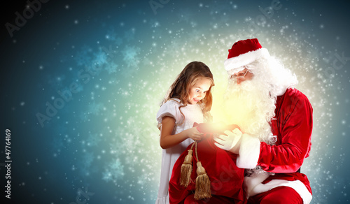 Photo: portrait of santa claus with a girl portrait of santa claus with a girl