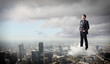 Businessman against cityscape