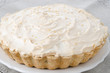 Lemon tart with meringue on a plate closeup horizontal