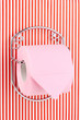 Roll of toilet paper on  holder fixed to pinstriped wall