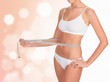 Woman taking measurements of her body