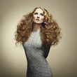 Portrait of beautiful woman in knitted dress