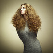 Portrait of beautiful woman in knitted dress