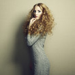 Portrait of beautiful woman in knitted dress