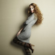 Portrait of beautiful woman in knitted dress