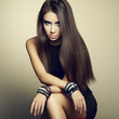 Portrait of beautiful brunette woman in black dress
