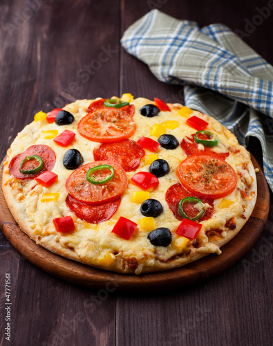 Photo: Pizza with salami and green chili pepper Pizza with salami and green chili pepper
