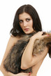 Photo: young woman in a fur coat young woman in a fur coat