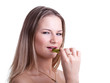 Sexy girl with a slice of kiwi fruit on a white background