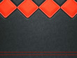 Leather background with red stitch and rhombuses