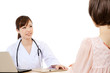 Foto: Beautiful young hospital staff on white background Beautiful young hospital staff on white background