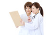 Foto: Beautiful young hospital staff on white background Beautiful young hospital staff on white background