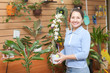 Mature woman chooses Dendrobium orchid