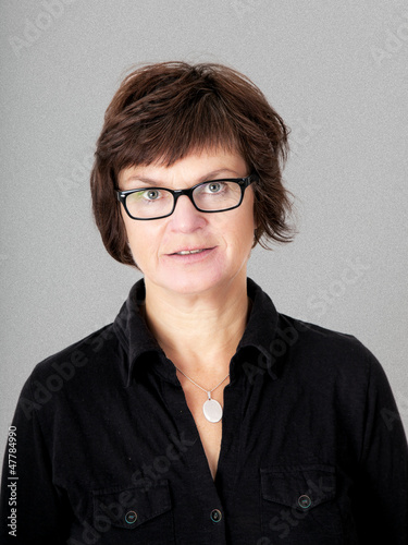 Photo: Woman with glasses in middle age Woman with glasses in middle age