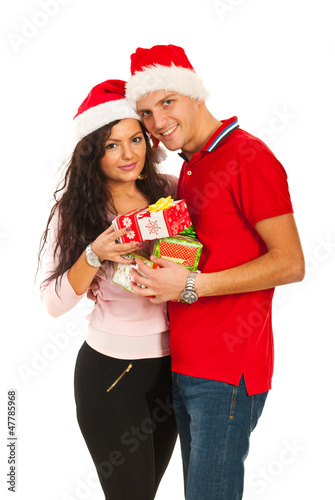 Photo: Happy Xmas couple holding presents Happy Xmas couple holding presents