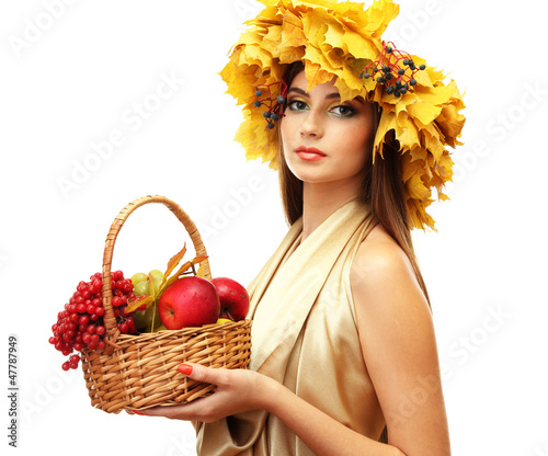 Photo: beautiful woman with wreath and basket with apples and berries, beautiful woman with wreath and basket with apples and berries,
