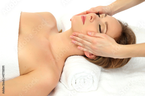 Photo: Portrait of beautiful woman taking head massage Portrait of beautiful woman taking head massage