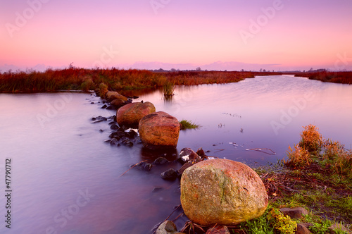Photo: big stones on river at sunrise big stones on river at sunrise