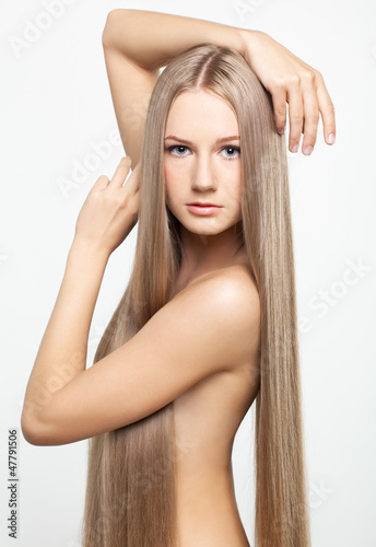 Photo: Portrait of young woman with long hair Portrait of young woman with long hair